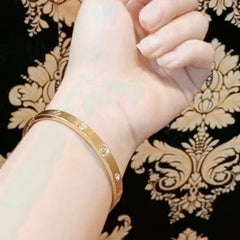 Gold Plated Screw Motif Bangle Bracelet with Crystal Accents