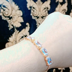 Gold Plated Emerald Cut Light Blue Crystal Tennis Bracelet